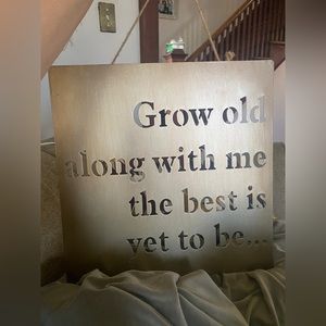 Hanging metal sign “grow old along with me the best is yet to be…”